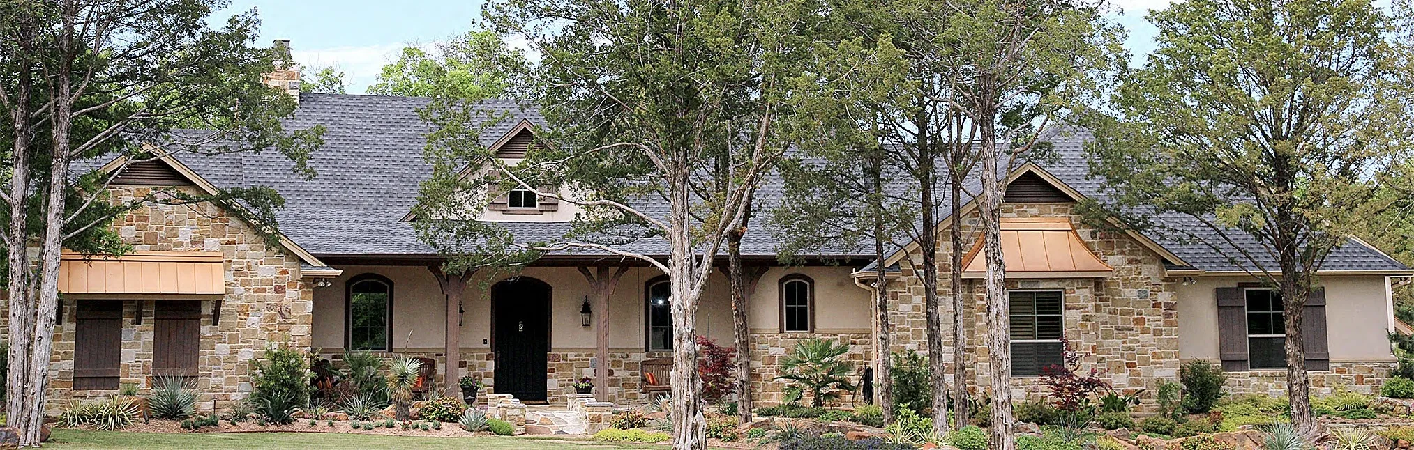A custom stone home built by Jack Steed Homes in North Central Texas